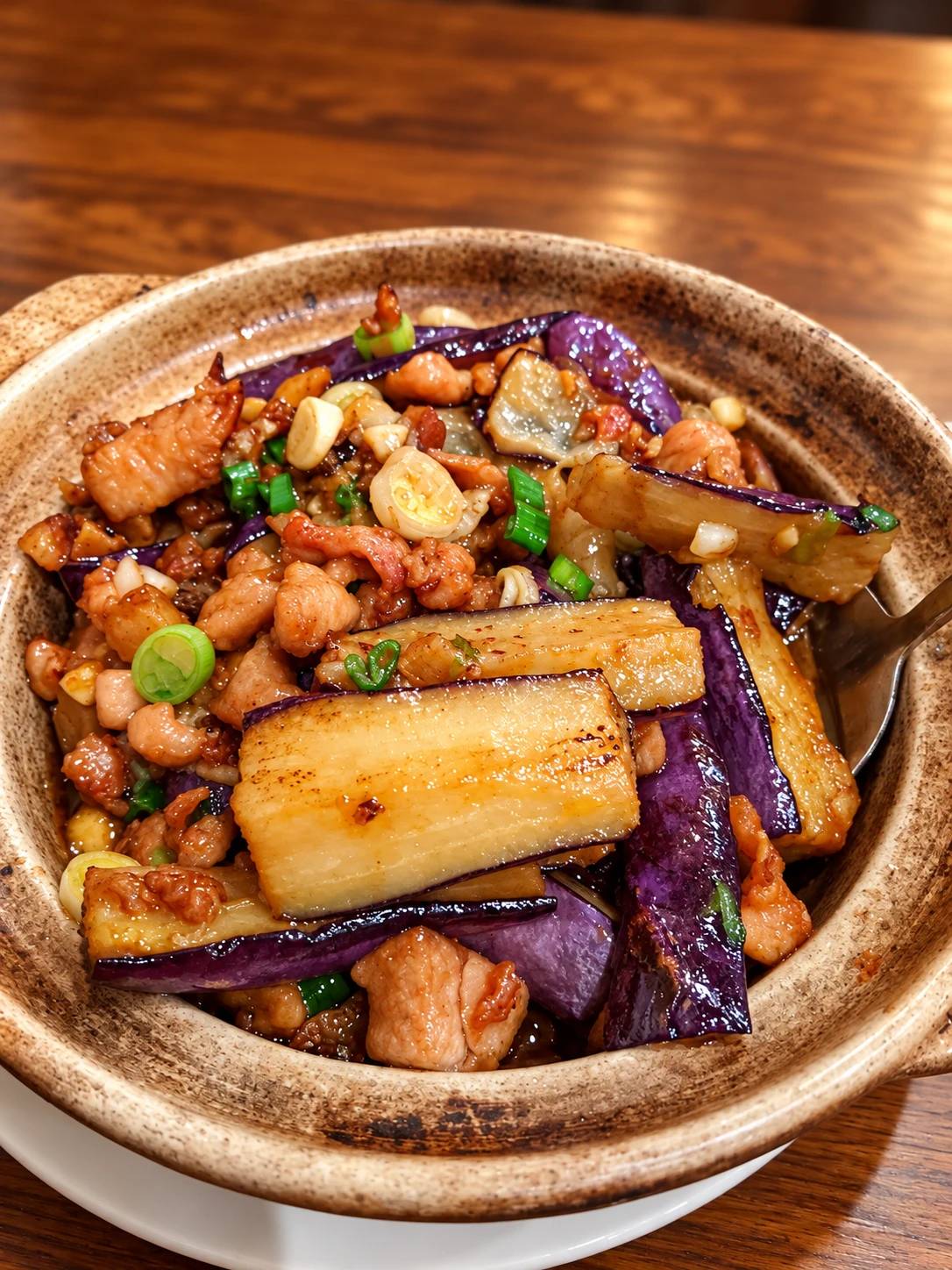 Clay-pot casserole of eggplant with minced pork, garlic and scallions.