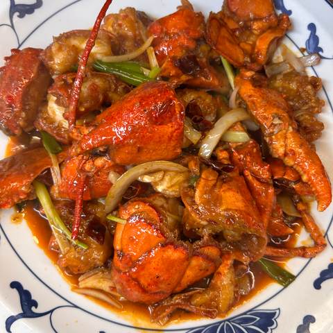 Two lobsters in chili sauce, photographed